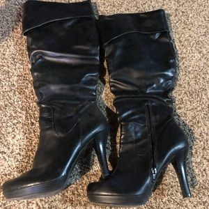 Black high heel boots.